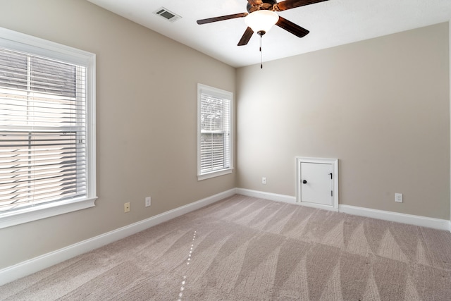 spare room with ceiling fan and carpet floors