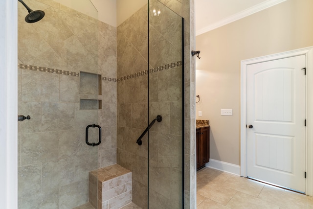 bathroom with vanity, tile patterned floors, walk in shower, and crown molding