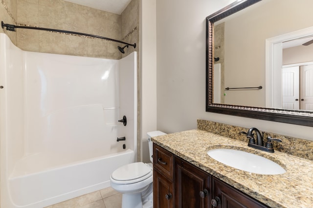 full bathroom featuring tile patterned flooring, vanity, toilet, and tub / shower combination