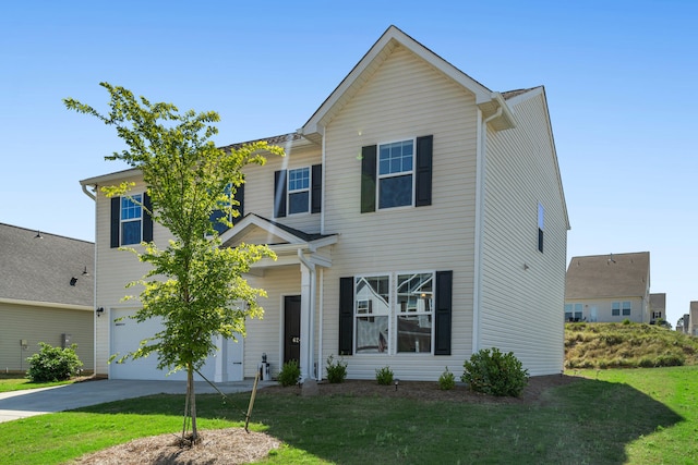 view of front of property with driveway, a front yard, and a garage