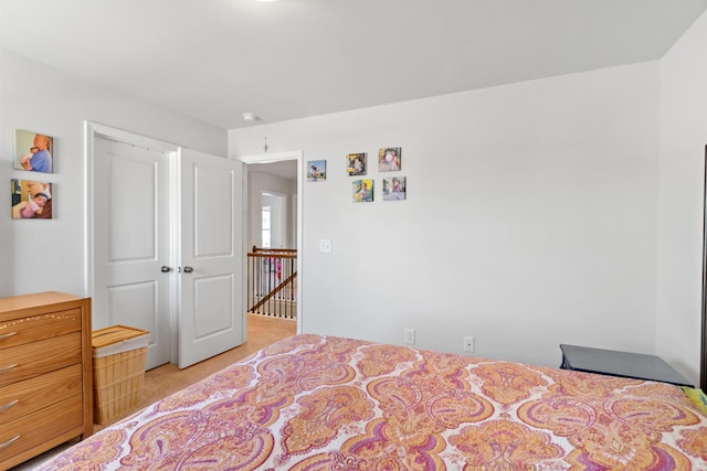 bedroom with light carpet