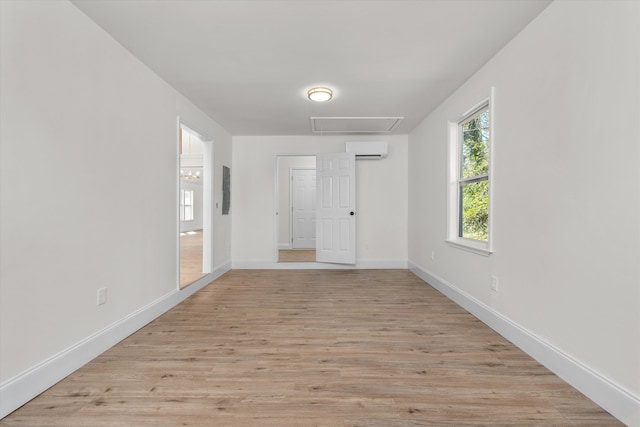 321 Padrick St, Martinez, GA 30907 - unfurnished room with an AC wall unit, light wood-style floors, and baseboards