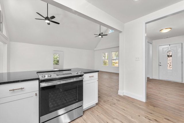 321 Padrick St, Martinez, GA 30907 - kitchen featuring stainless steel range with electric stovetop, a ceiling fan, vaulted ceiling, white cabinetry, and open floor plan
