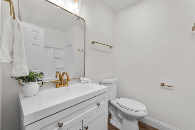 321 Padrick St, Martinez, GA 30907 - full bath featuring vanity, toilet, wood finished floors, and baseboards