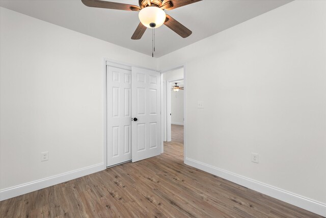 321 Padrick St, Martinez, GA 30907 - unfurnished bedroom featuring baseboards, wood finished floors, a closet, and ceiling fan