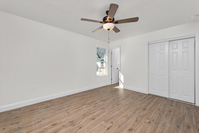 321 Padrick St, Martinez, GA 30907 - unfurnished bedroom featuring wood finished floors, baseboards, a closet, and a ceiling fan