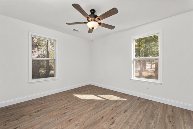 321 Padrick St, Martinez, GA 30907 - empty room with healthy amount of natural light, baseboards, wood finished floors, and a ceiling fan