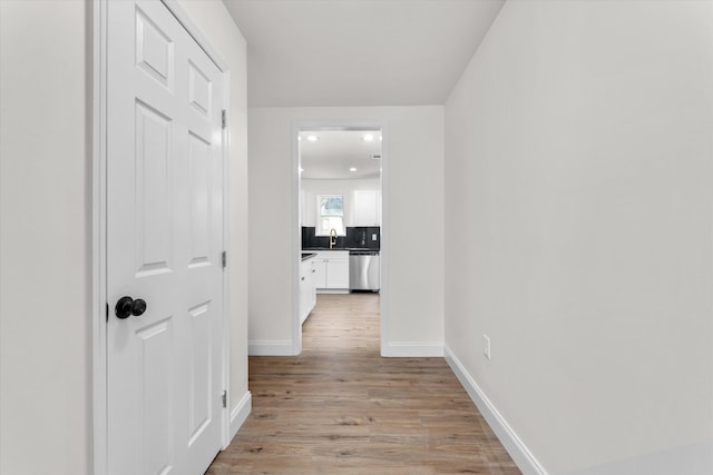 321 Padrick St, Martinez, GA 30907 - corridor with light wood-style flooring, baseboards, recessed lighting, and a sink
