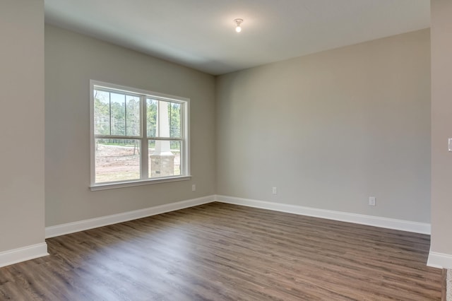 empty room featuring dark hardwood / wood-style floors