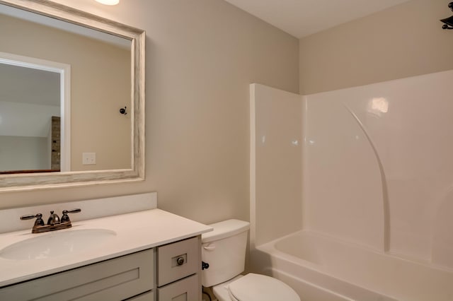 full bathroom with vanity, shower / bath combination, and toilet