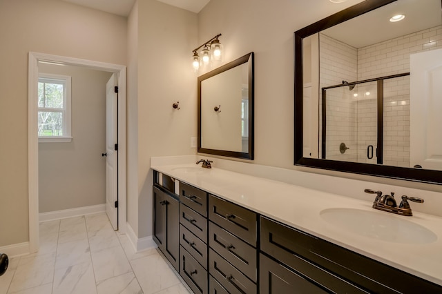 bathroom featuring vanity and an enclosed shower