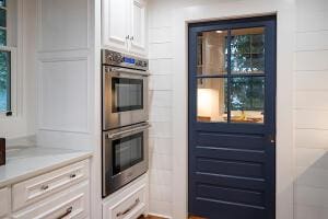 1792 Appleton Rd, Allendale, SC 29810 - kitchen with white cabinetry and stainless steel double oven