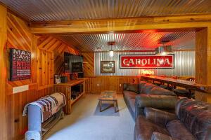 1792 Appleton Rd, Allendale, SC 29810 - living room featuring beam ceiling and wooden walls