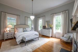 1792 Appleton Rd, Allendale, SC 29810 - bedroom featuring wood-type flooring, an inviting chandelier, and ornamental molding