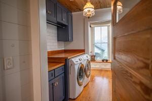 1792 Appleton Rd, Allendale, SC 29810 - washroom featuring separate washer and dryer, cabinets, wooden ceiling, and light hardwood / wood-style floors