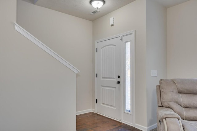 entrance foyer with dark hardwood / wood-style floors