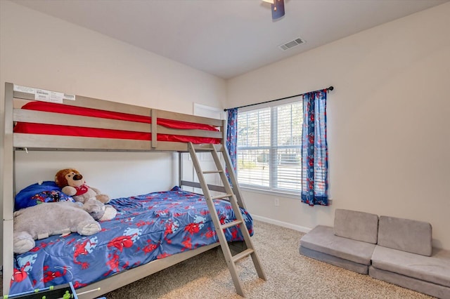 bedroom with ceiling fan and carpet