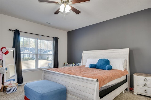 bedroom with ceiling fan and light carpet