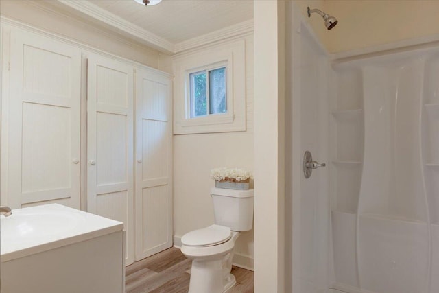 65 W Calhoun St, Wadley, GA 30477 - bathroom featuring a shower, hardwood / wood-style floors, vanity, and ornamental molding