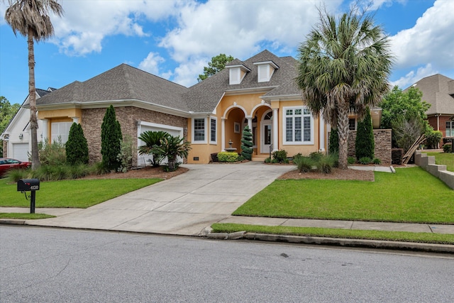 4120 Shady Oaks Dr, Martinez, GA 30907 - traditional home with stucco siding, driveway, a shingled roof, a front lawn, and a garage