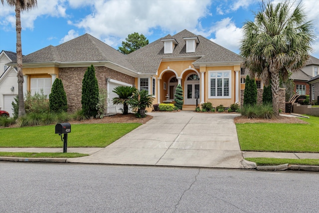 4120 Shady Oaks Dr, Martinez, GA 30907 - traditional-style home with driveway, a front yard, stucco siding, and roof with shingles