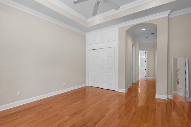 4120 Shady Oaks Dr, Martinez, GA 30907 - unfurnished room with arched walkways, a ceiling fan, crown molding, and light wood-style floors
