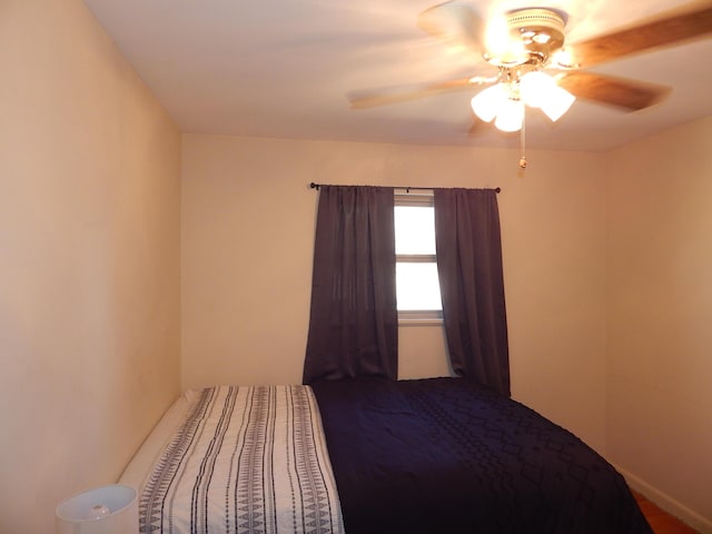 unfurnished bedroom featuring ceiling fan