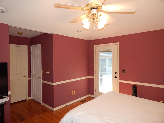 bedroom featuring ceiling fan and dark hardwood / wood-style flooring