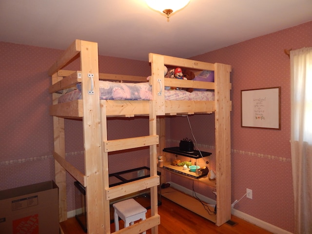 bedroom featuring wood-type flooring