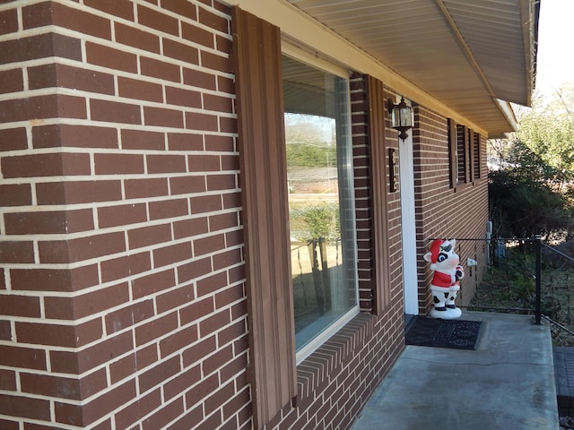 view of exterior entry featuring a porch