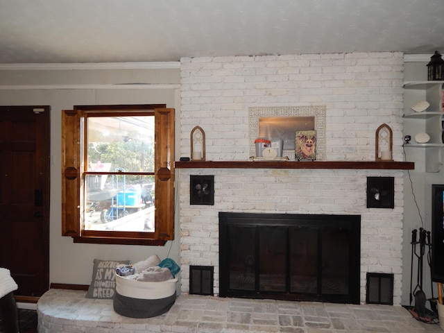 living room featuring a brick fireplace