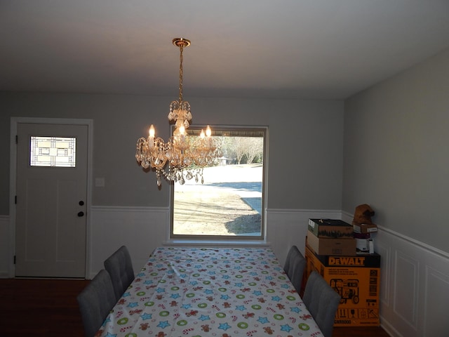 dining area featuring a notable chandelier