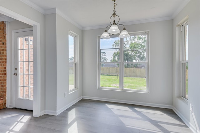 301 Cobblestone Ct, Martinez, GA 30907 - unfurnished dining area featuring healthy amount of natural light, wood finished floors, and crown molding