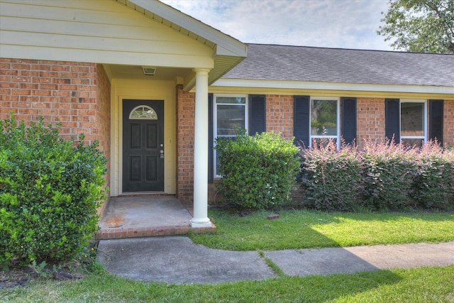 301 Cobblestone Ct, Martinez, GA 30907 - property entrance featuring brick siding, roof with shingles, and a lawn