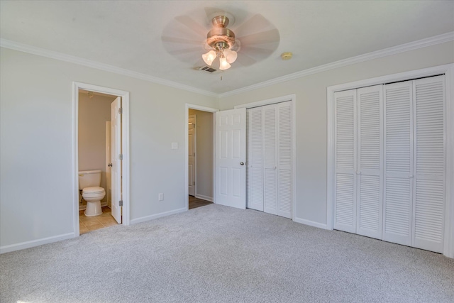 301 Cobblestone Ct, Martinez, GA 30907 - unfurnished bedroom with ornamental molding, two closets, carpet flooring, ensuite bathroom, and a ceiling fan