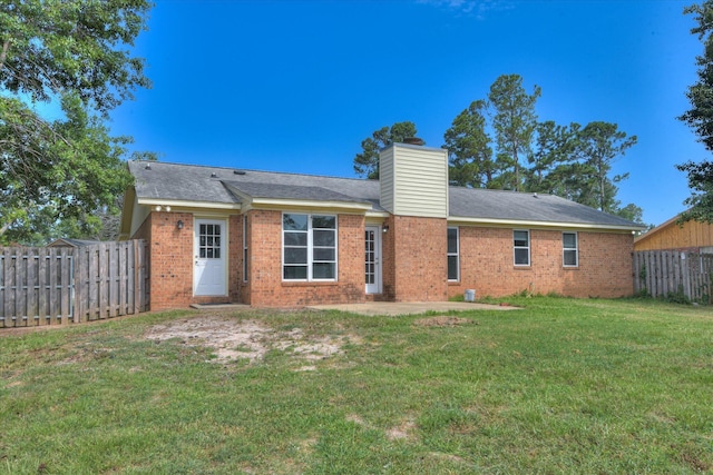 301 Cobblestone Ct, Martinez, GA 30907 - back of house with a patio area, a chimney, and brick siding