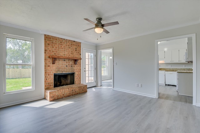 301 Cobblestone Ct, Martinez, GA 30907 - unfurnished living room with ceiling fan, light wood-style flooring, plenty of natural light, and crown molding