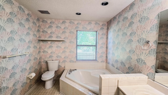206 W Amelia Dr, Martinez, GA 30907 - bathroom featuring a bath, a textured ceiling, toilet, visible vents, and vanity