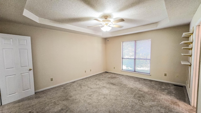 206 W Amelia Dr, Martinez, GA 30907 - carpeted spare room featuring ceiling fan, baseboards, a textured ceiling, and a raised ceiling