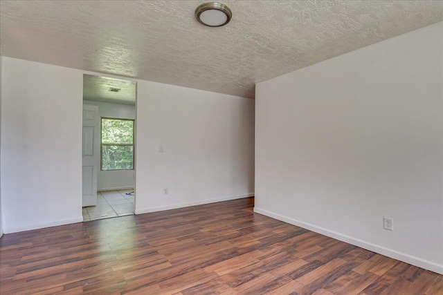 2028 Wharton Dr, Augusta, GA 30904 - empty room with wood finished floors and a textured ceiling
