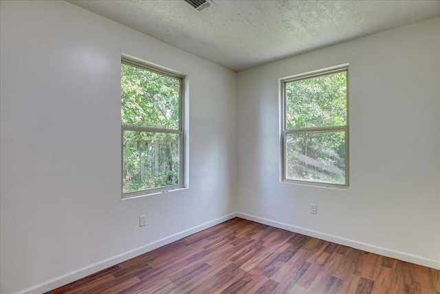 2028 Wharton Dr, Augusta, GA 30904 - unfurnished room with dark wood-type flooring and a textured ceiling
