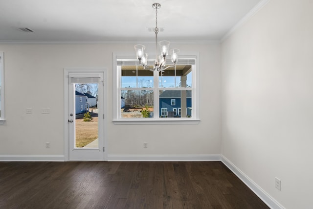 unfurnished dining area with ornamental molding, a healthy amount of sunlight, and a notable chandelier