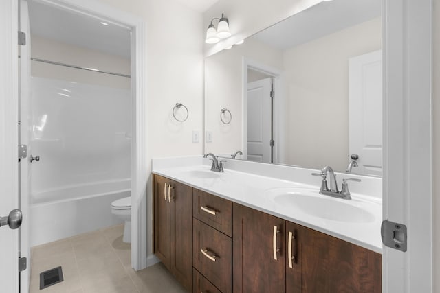 full bathroom featuring toilet, vanity, shower / washtub combination, and tile patterned flooring