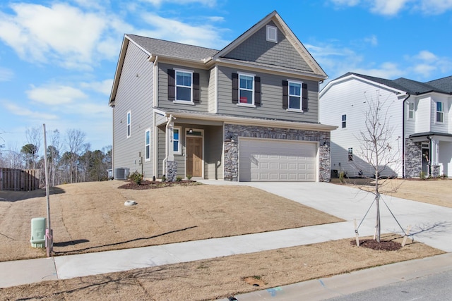 front facade featuring a garage and central AC