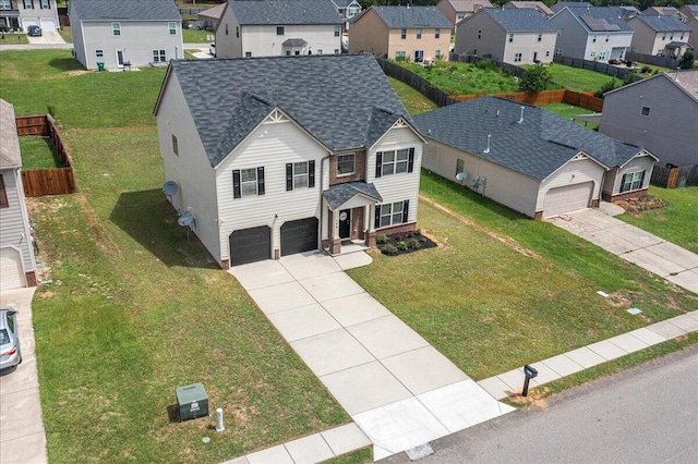 view of front facade with a front yard and a garage