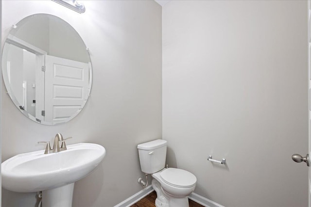 bathroom with sink and toilet