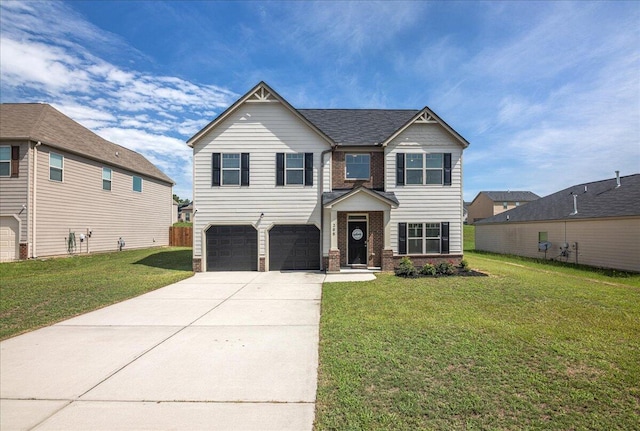 view of front of property featuring a garage and a front lawn