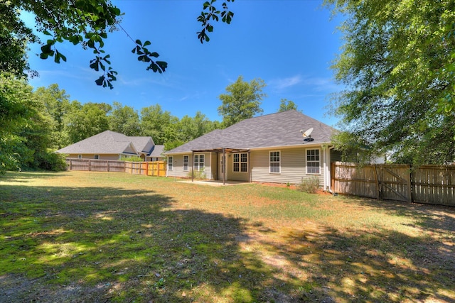back of property with a patio