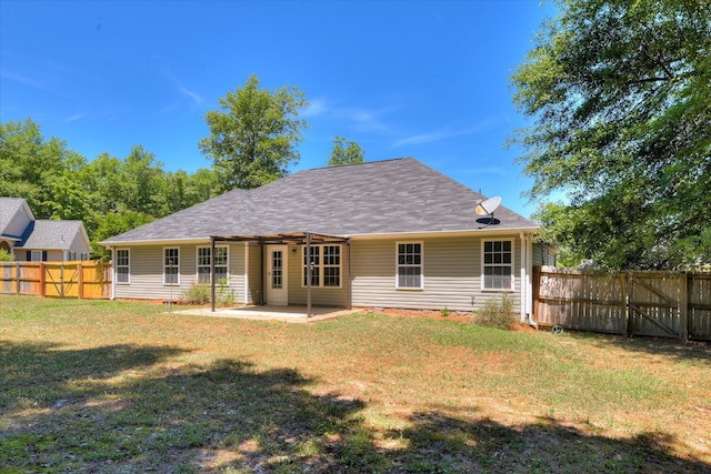 back of property featuring a patio area and roof with shingles