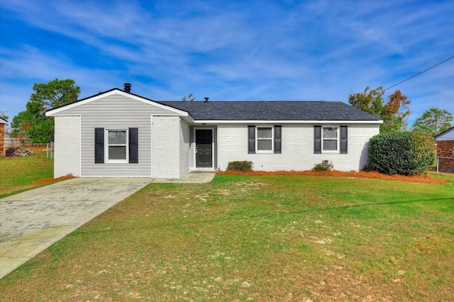 ranch-style house with a front lawn